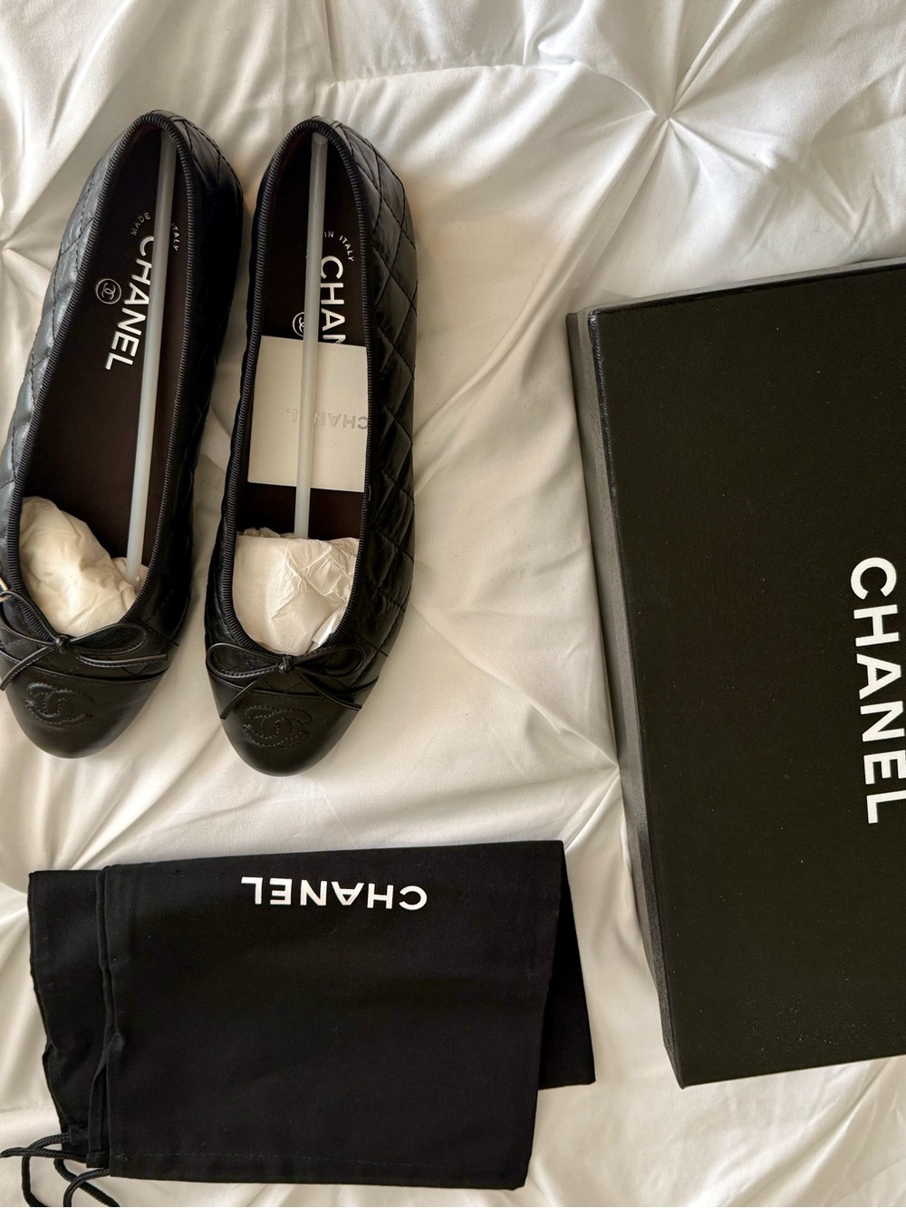 CHANEL Black Quilted Leather Ballet Flats with Logo Cap Toe